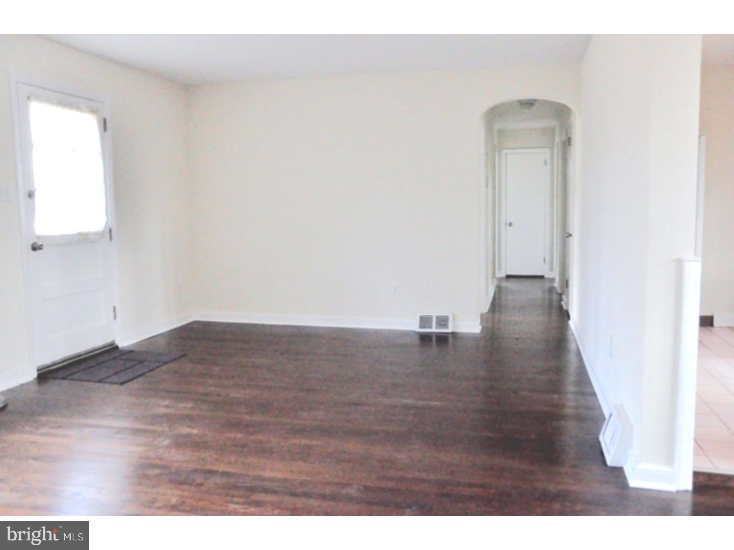 591 Farnum Road Media, PA 19063 - Photo 6 of 21 a view of a room with wooden floor and a window