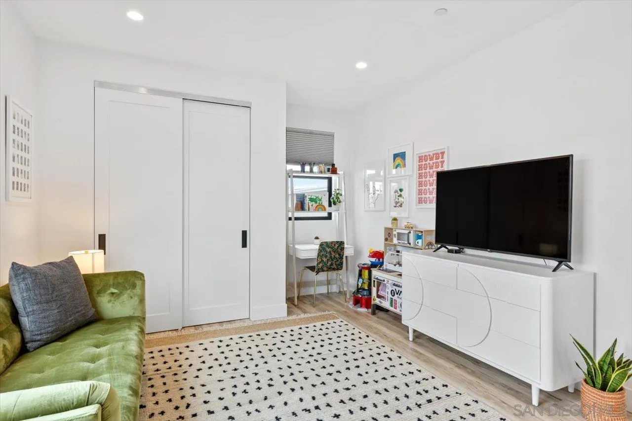 1604 Legaye Drive Encinitas, CA 92007 - Photo 16 of 43 a living room with furniture and a flat screen tv