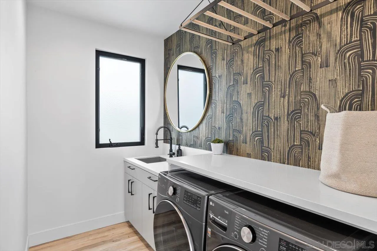 1604 Legaye Drive Encinitas, CA 92007 - Photo 19 of 43 a bathroom with a sink and a mirror