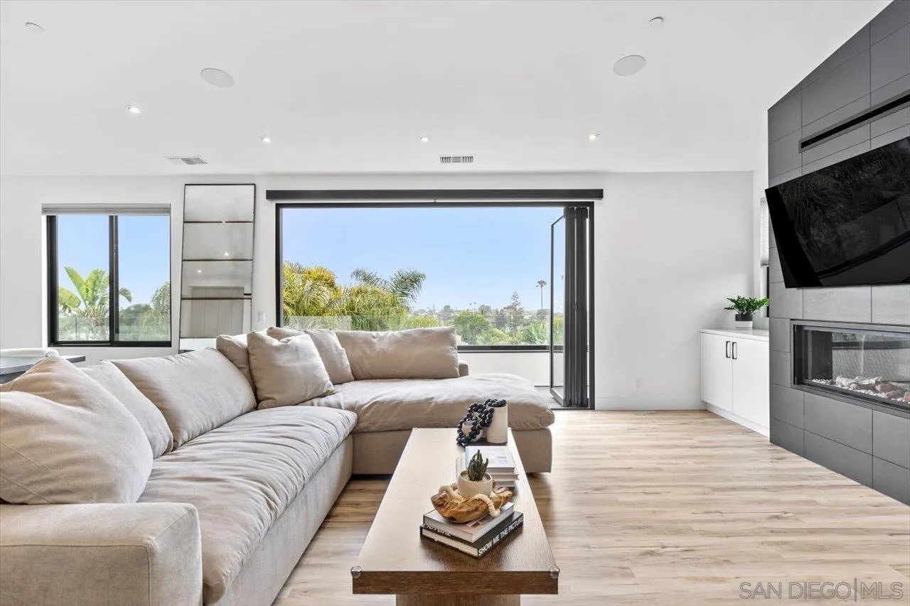 1604 Legaye Drive Encinitas, CA 92007 - Photo 2 of 43 a living room with furniture and a flat screen tv