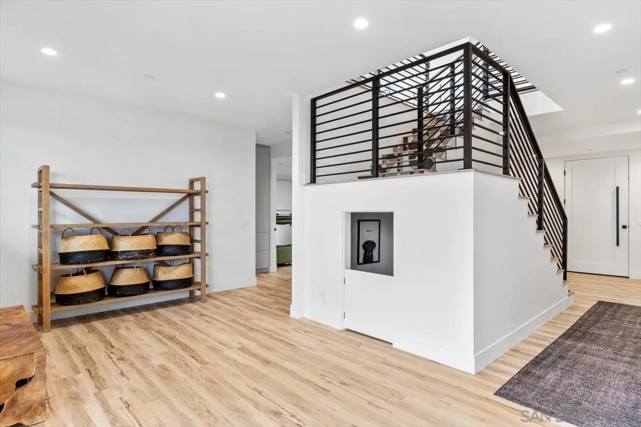 1604 Legaye Drive Encinitas, CA 92007 - Photo 22 of 43 a view of a livingroom with wooden floor and furniture