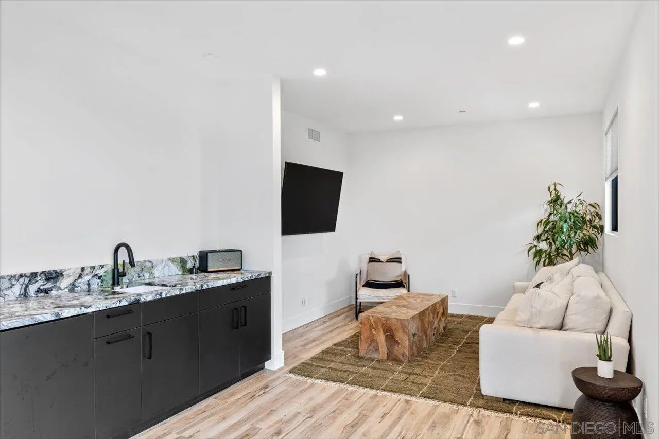 1604 Legaye Drive Encinitas, CA 92007 - Photo 23 of 43 a living room with furniture and a flat screen tv