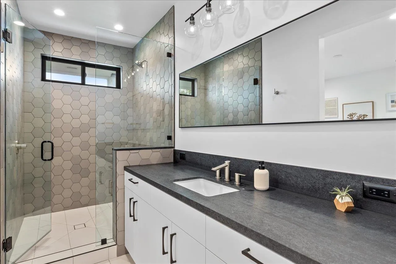 1604 Legaye Drive Encinitas, CA 92007 - Photo 31 of 43 a bathroom with a sink and a mirror