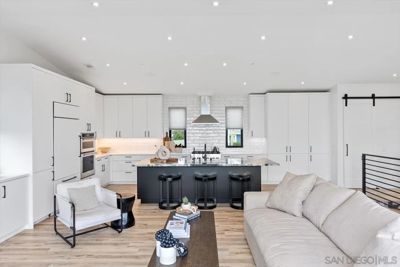 1604 Legaye Drive Encinitas, CA 92007 - Photo 4 of 43 a view of a living room kitchen and a wooden floor