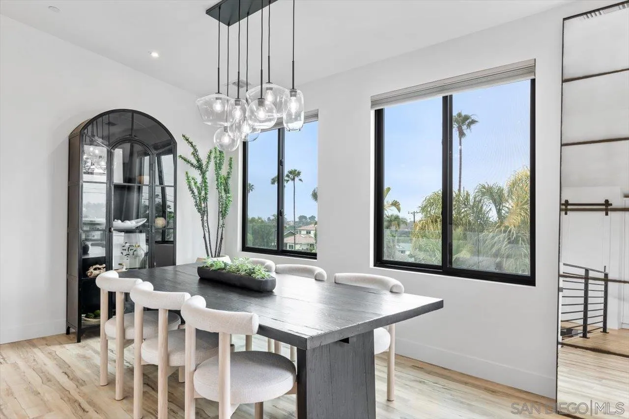 1604 Legaye Drive Encinitas, CA 92007 - Photo 7 of 43 a view of a dining room with furniture window and wooden floor