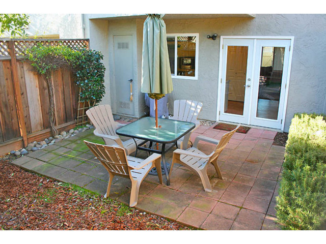 292 Perch Way Seacliff, CA 95003 - Photo 11 of 13 a backyard of a house with table and chairs
