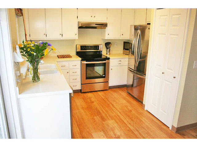 292 Perch Way Seacliff, CA 95003 - Photo 5 of 13 a kitchen with refrigerator and cabinets