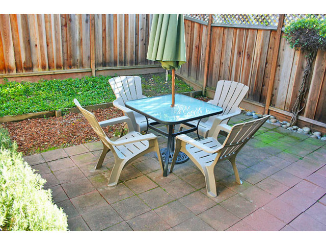 292 Perch Way Seacliff, CA 95003 - Photo 10 of 13 a view of a chairs and table in backyard