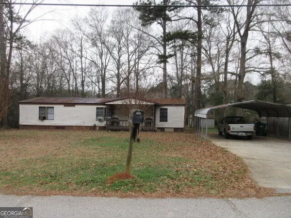a view of a house with a back yard