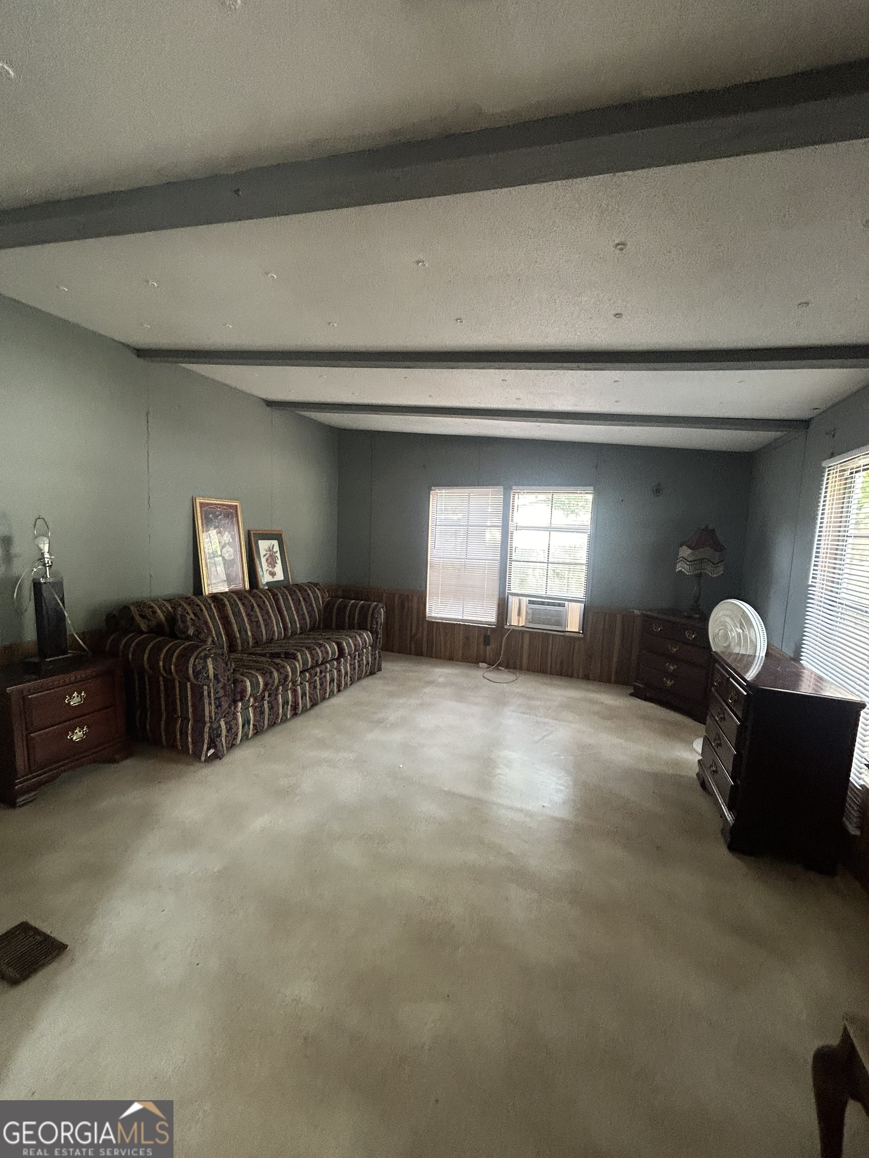 264 Lakeview Drive Locust Grove, GA 30248 - Photo 6 of 13 a view of a livingroom with furniture and windows