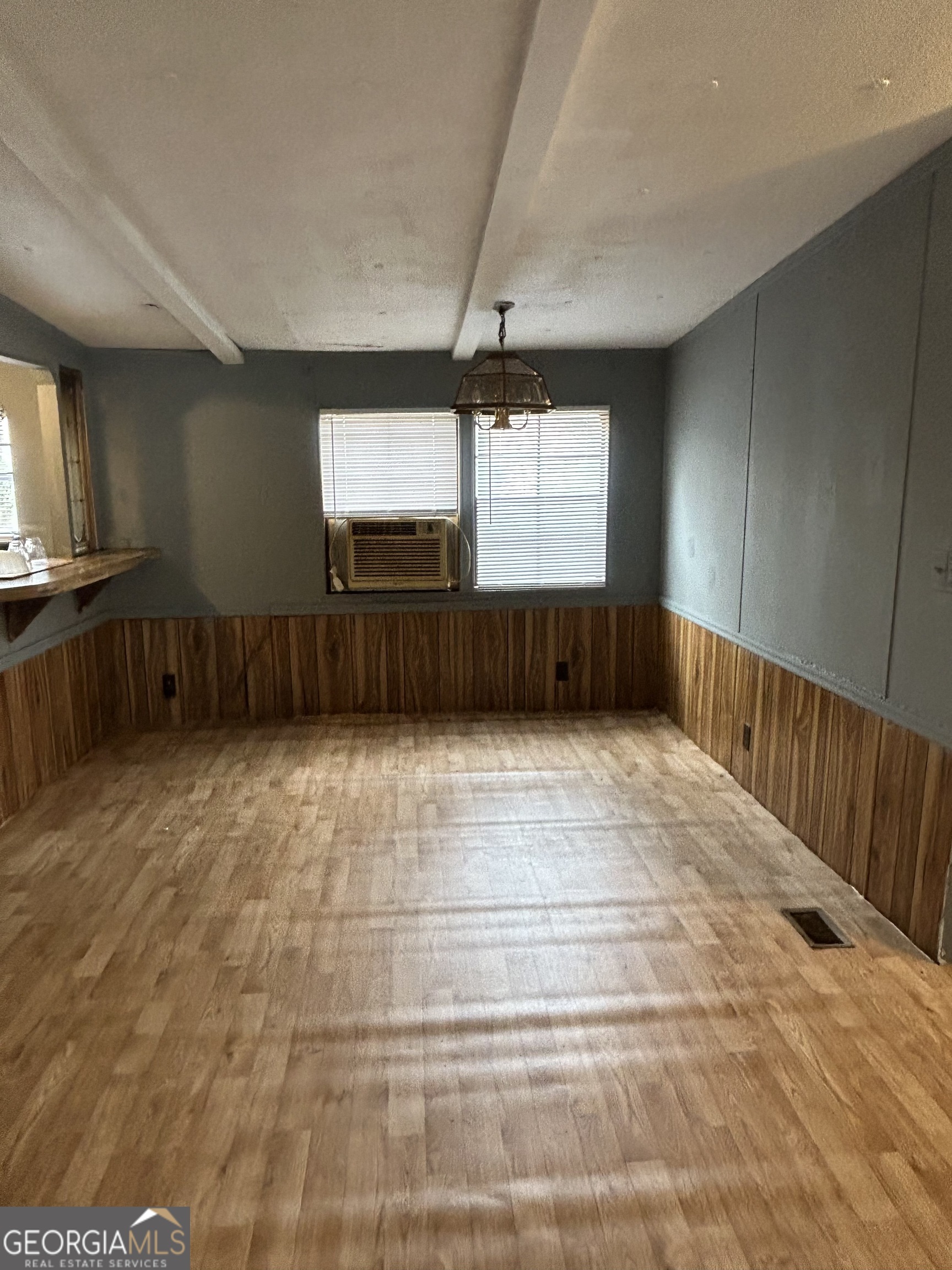 264 Lakeview Drive Locust Grove, GA 30248 - Photo 10 of 13 a view of an empty room with windows & cabinet