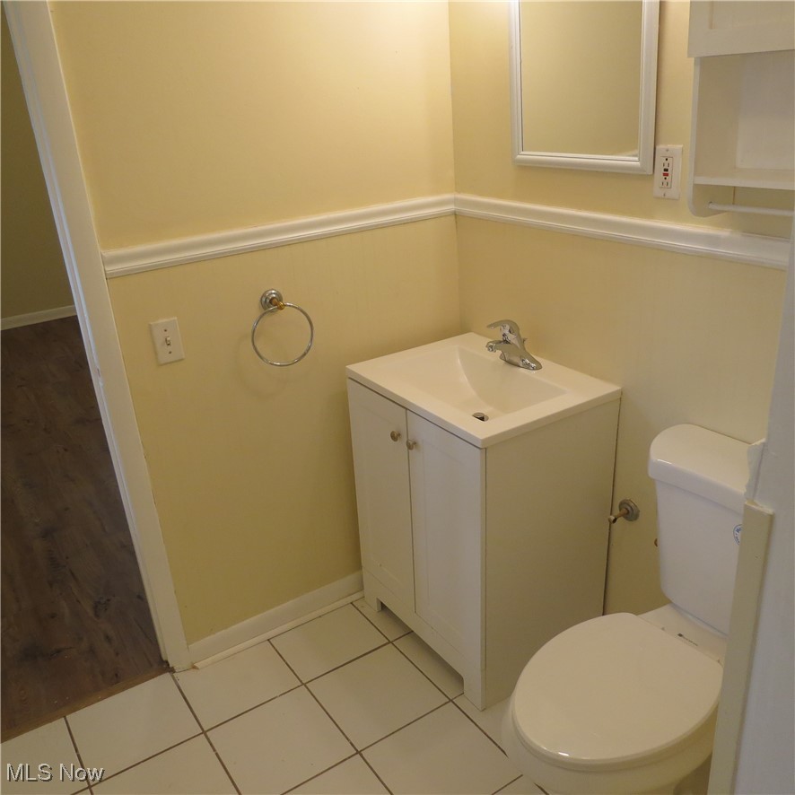 430 High Meadow Road Amherst, OH 44001 - Photo 14 of 29 Bathroom featuring vanity, toilet, and tile patterned floors