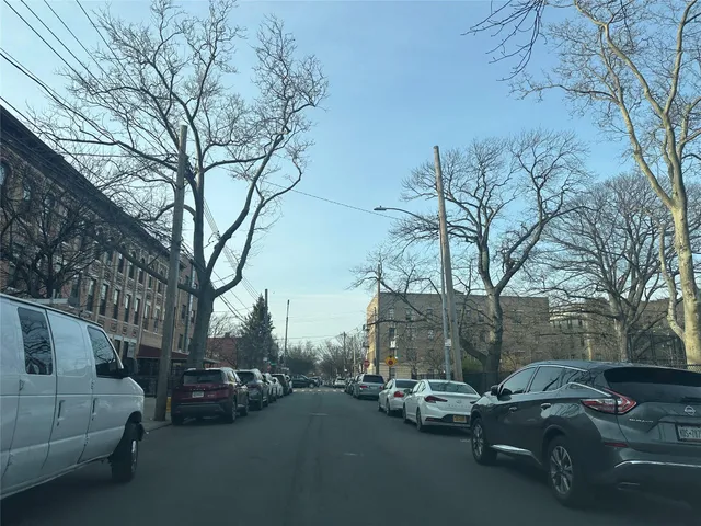 a view of a cars park in front of a house