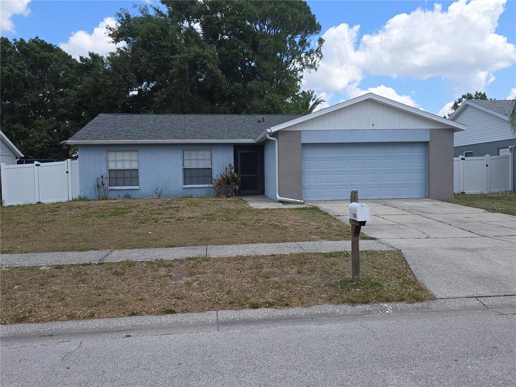 12825 Tallowood Drive Riverview, FL 33579 - Photo 1 of 10 a front view of a house with a yard