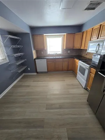 a view of an empty room with a window