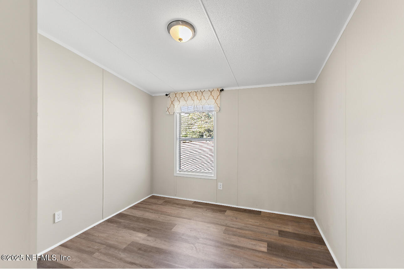 86090 Jean Road Yulee, FL 32097 - Photo 11 of 22 an empty room with windows