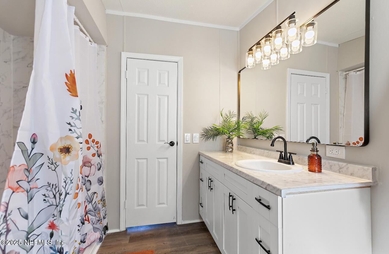 86090 Jean Road Yulee, FL 32097 - Photo 14 of 22 a bathroom with a sink and a mirror
