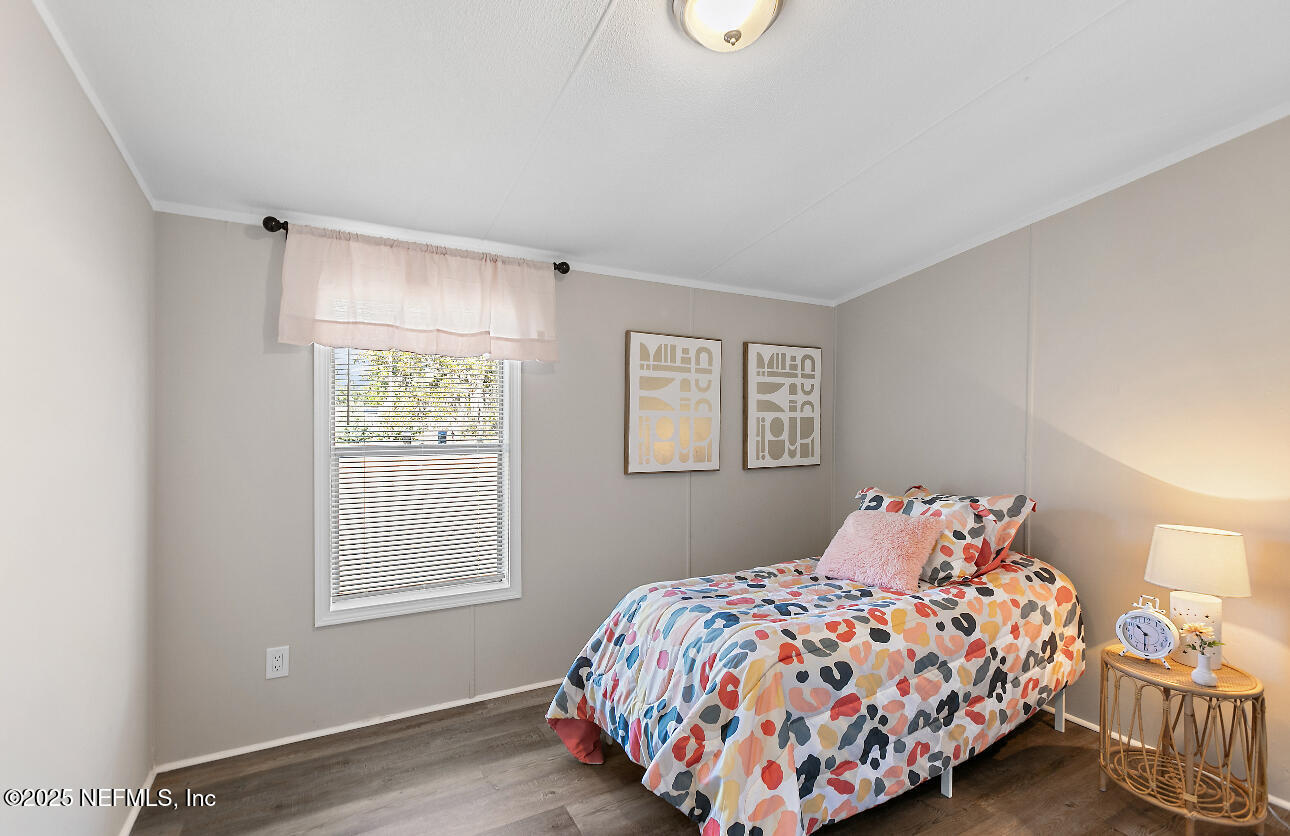 86090 Jean Road Yulee, FL 32097 - Photo 9 of 22 a bedroom with a bed and a window