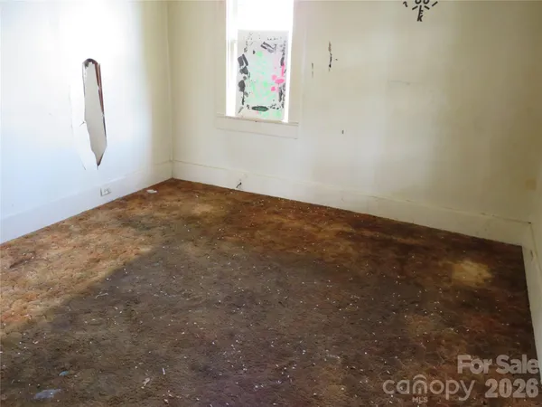 an empty room with windows