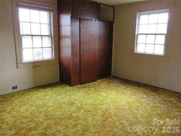 an empty room with windows