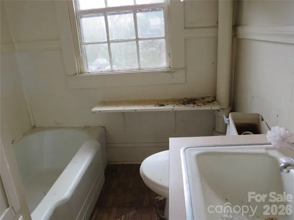 a bathroom with a sink and bathtub