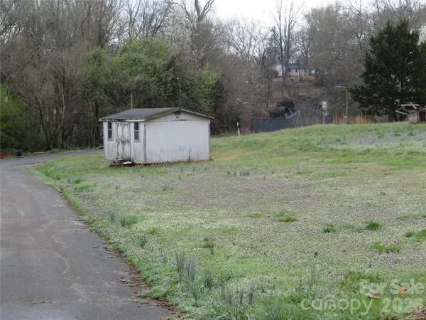 a view of a tiny house with a yard