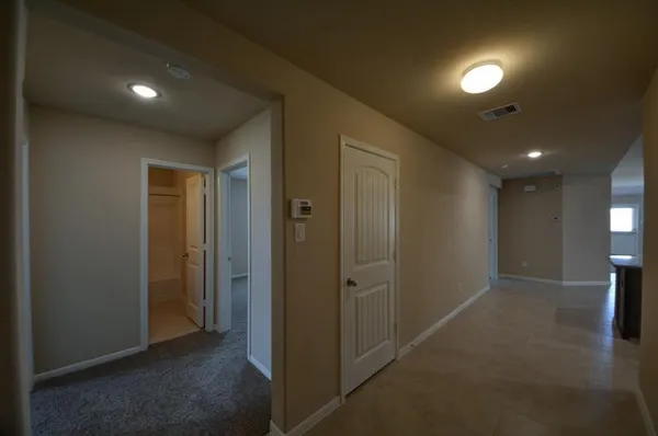 a view of hallway with livingroom