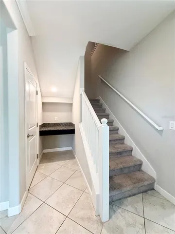 a view of entryway and kitchen