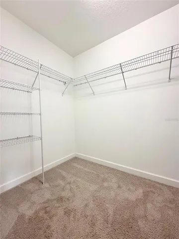 a view of a room with racks on the wall