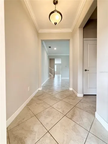 a view of a room with wooden floor and glass door