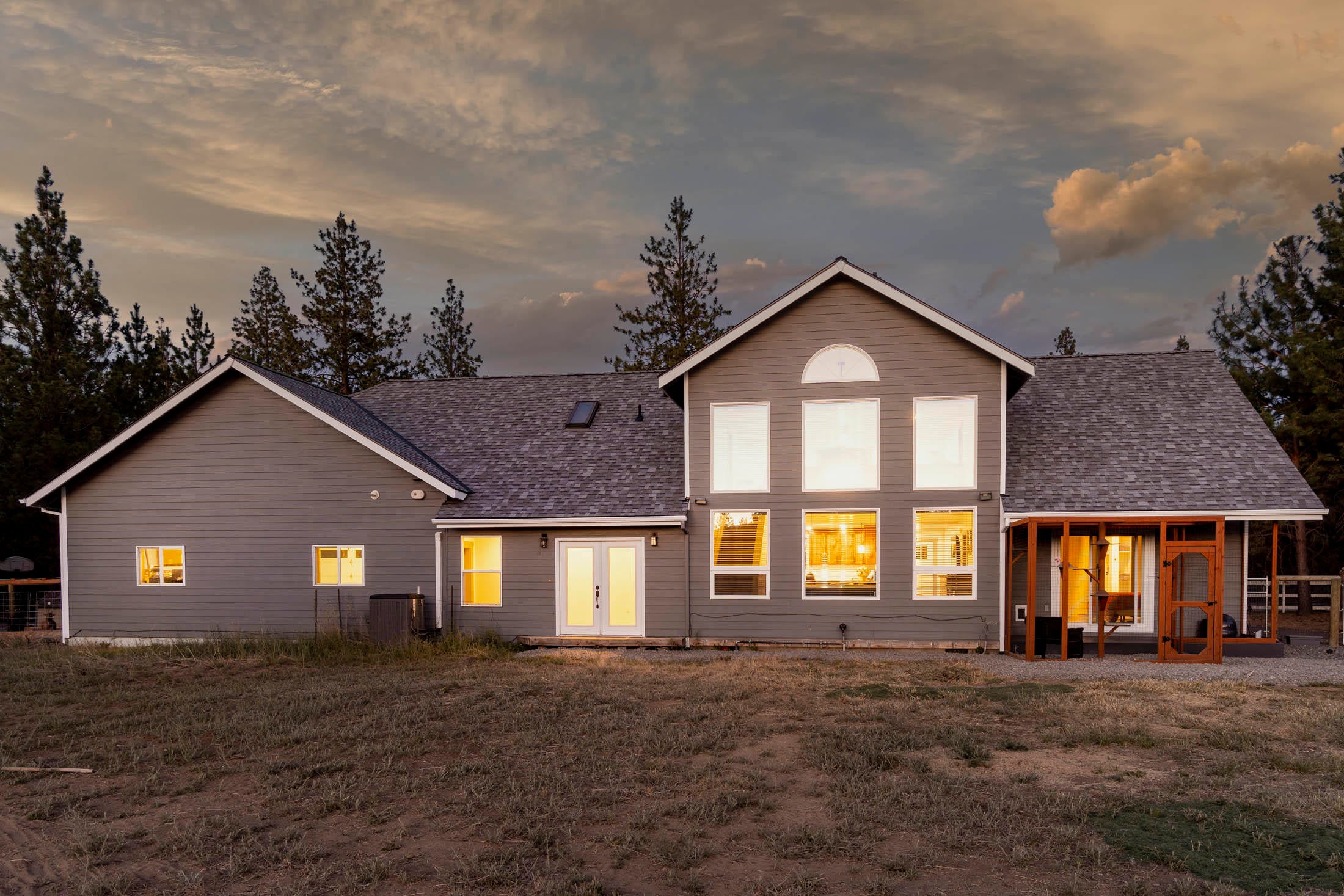 19166 Buck Canyon Road Bend, OR 97702 - Photo 55 of 63 Back of home at dusk