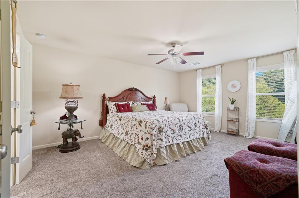 608 Myers Gate Road Ball Ground, GA 30107 - Photo 18 of 31 a bedroom with a bed and a couch