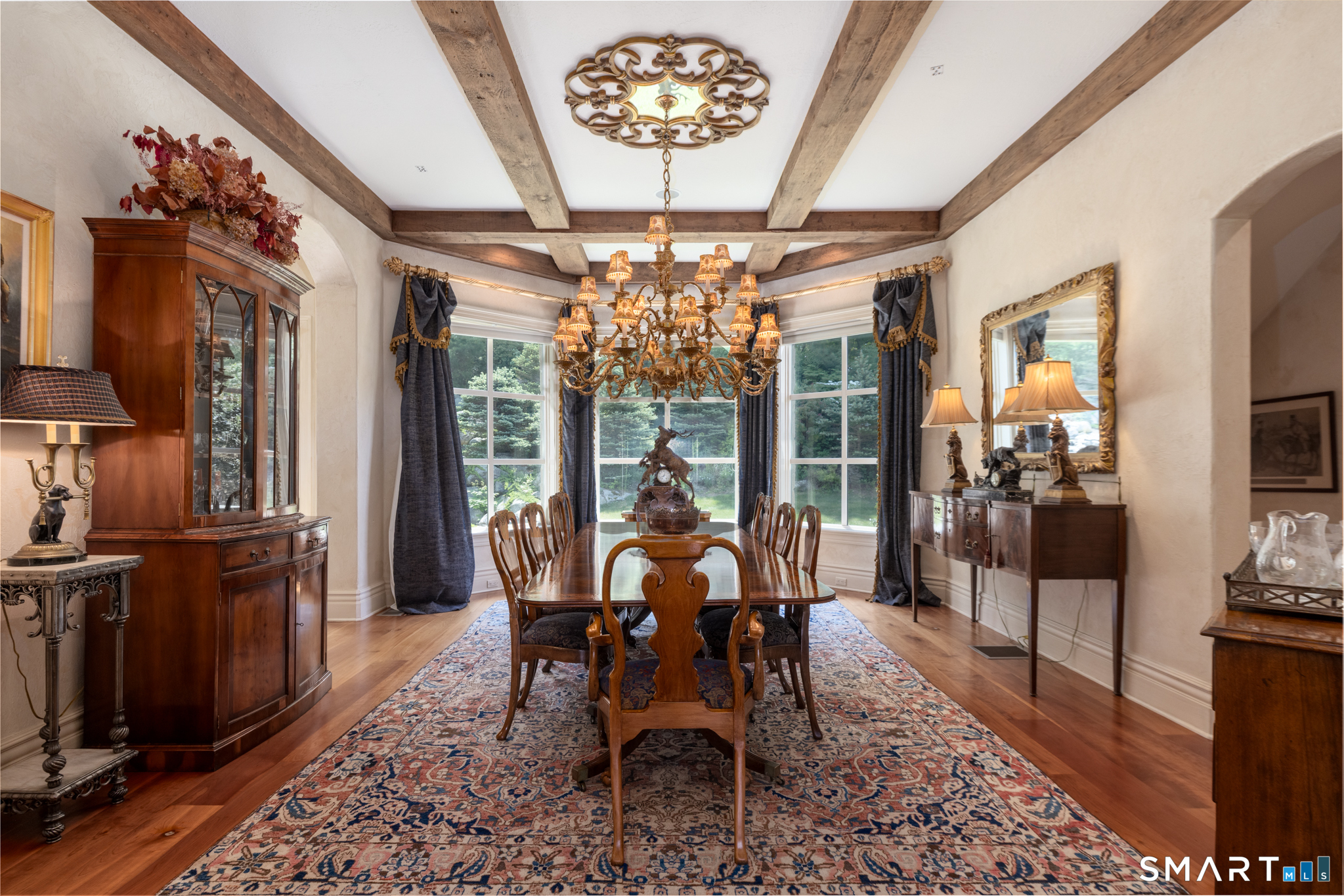 7 Equestrian Ridge Newtown, CT 06470 - Photo 13 of 40 a view of a dining room with furniture wooden floor and chandelier