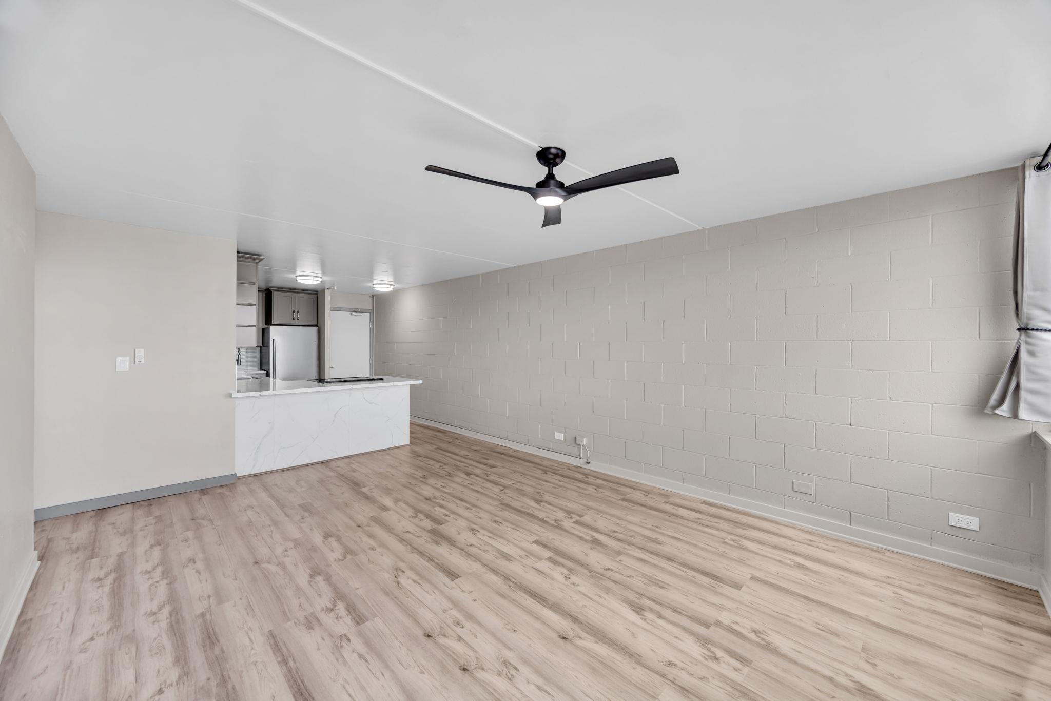 111 Kahului Beach Road, Unit A310 Kahului, HI 96732 - Photo 13 of 35 a view of empty room with wooden floor and ceiling fan