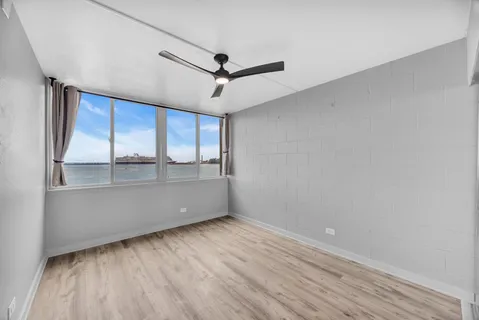 a room with a wooden floor and window