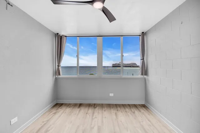 a view of an empty room with a window