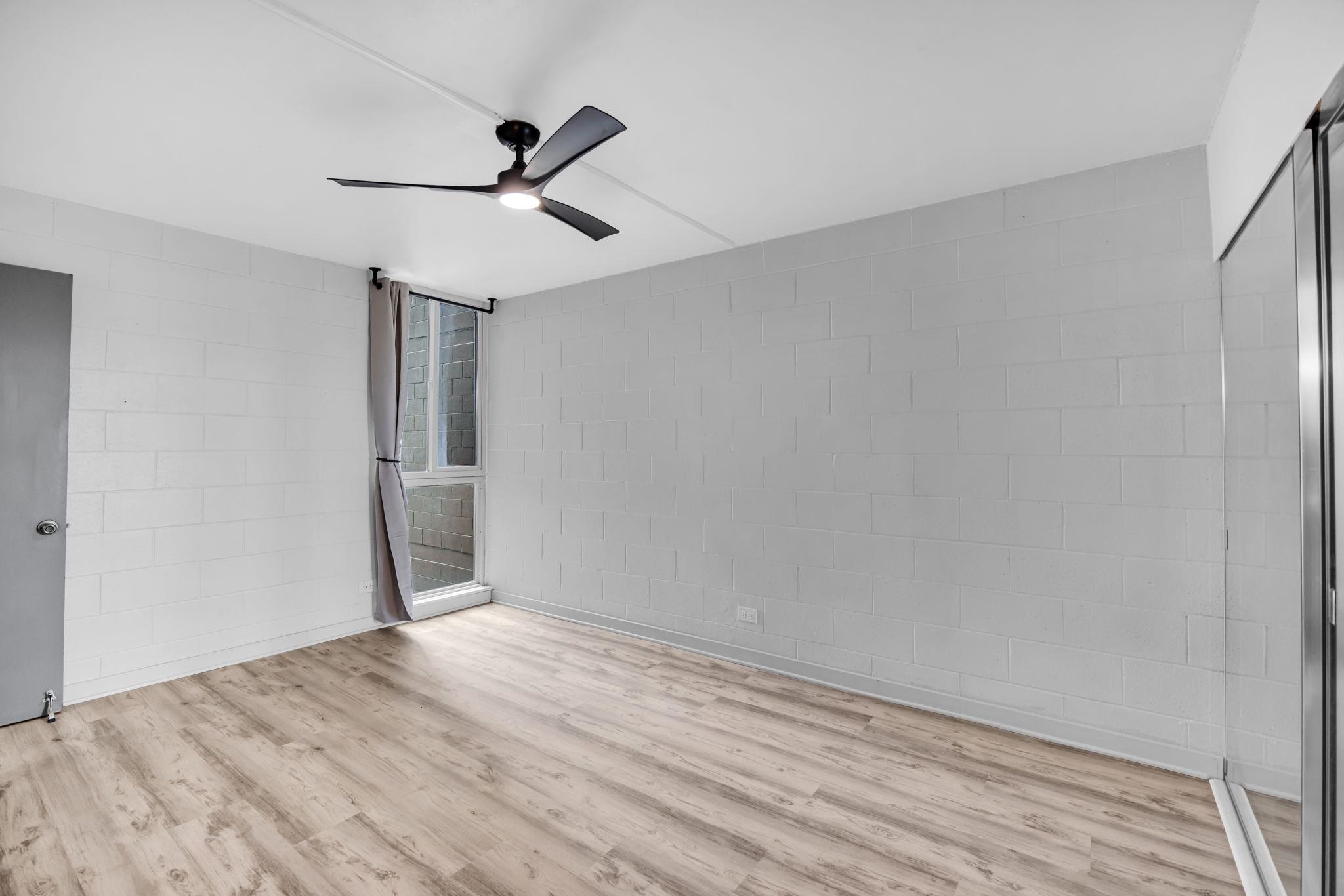 111 Kahului Beach Road, Unit A310 Kahului, HI 96732 - Photo 17 of 35 a view of empty room with wooden floor and ceiling fan