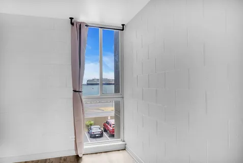 a bathroom with a sink toilet and mirror