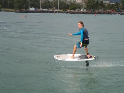 a view of a field with an ocean