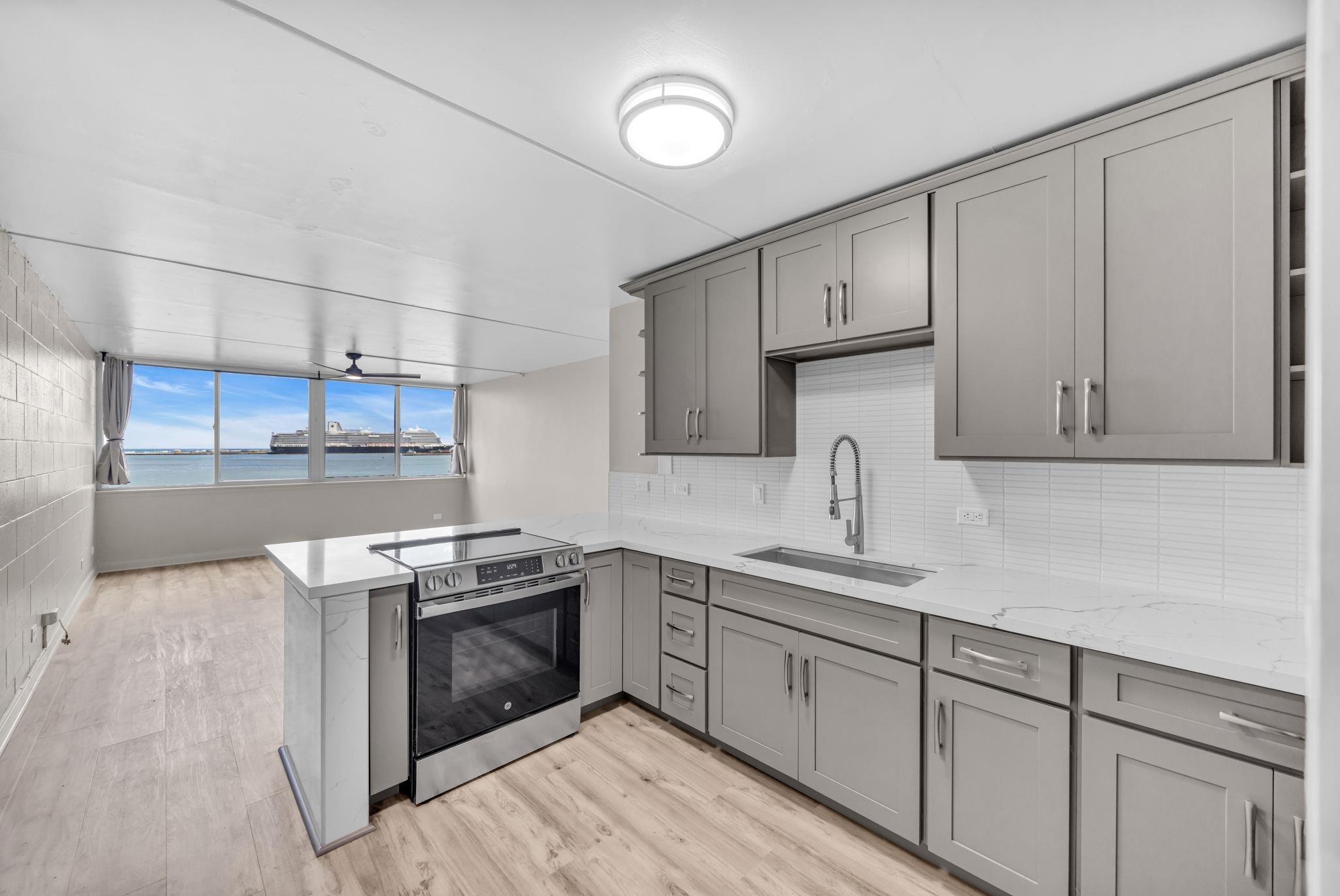 111 Kahului Beach Road, Unit A310 Kahului, HI 96732 - Photo 3 of 35 a kitchen with cabinets stainless steel appliances and sink