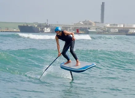 a view of outdoor space with stove and lake view