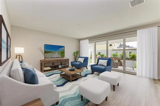 a living room with furniture and a large window