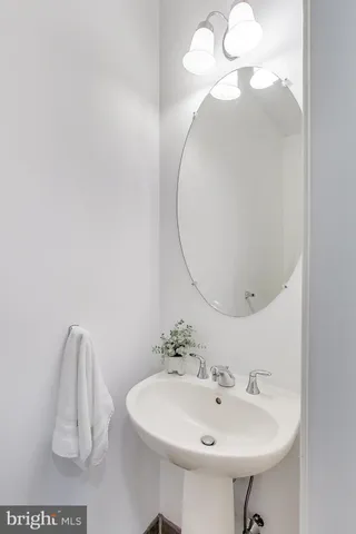 a bathroom with a sink a mirror and vanity