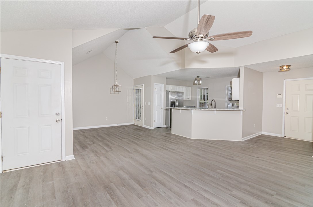 102 Hawk Ridge Drive Anderson, SC 29621 - Photo 32 of 38 This bright living space features vaulted ceilings and an open-concept kitchen.