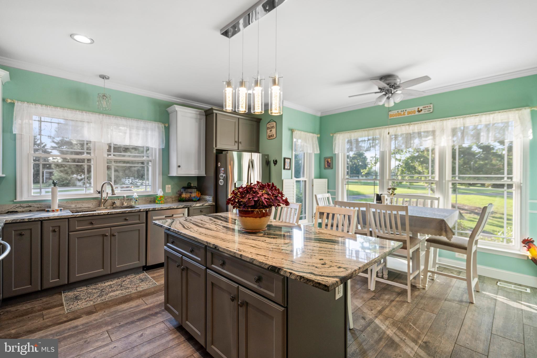27472 Strawberry Hill Road Rhoadesville, VA 22542 - Photo 4 of 30 a kitchen with sink cabinets and dining table