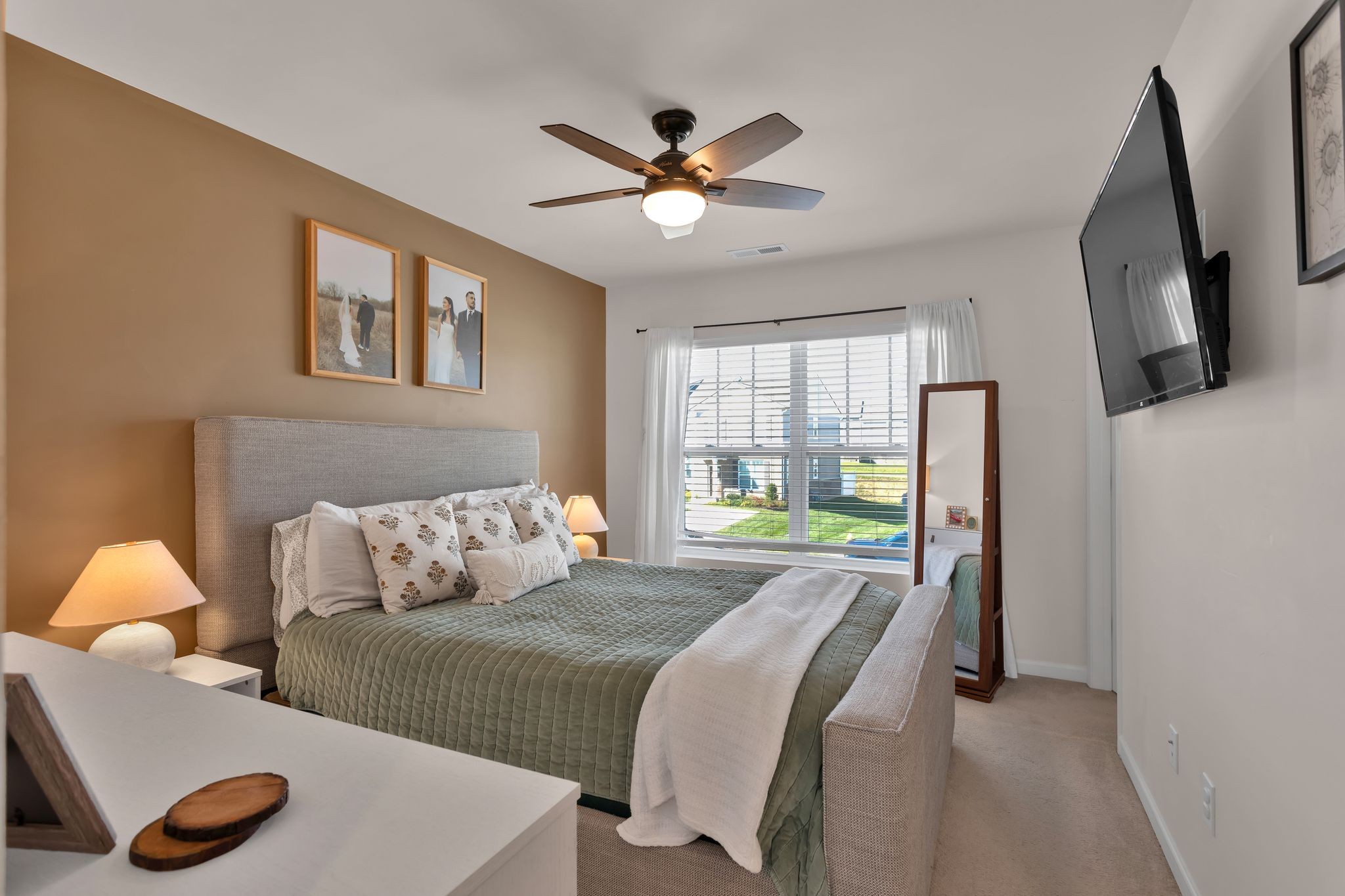 2533 Drumwright Way Columbia, TN 38401 - Photo 13 of 27 a bedroom with a bed and a large window with a flat tv screen