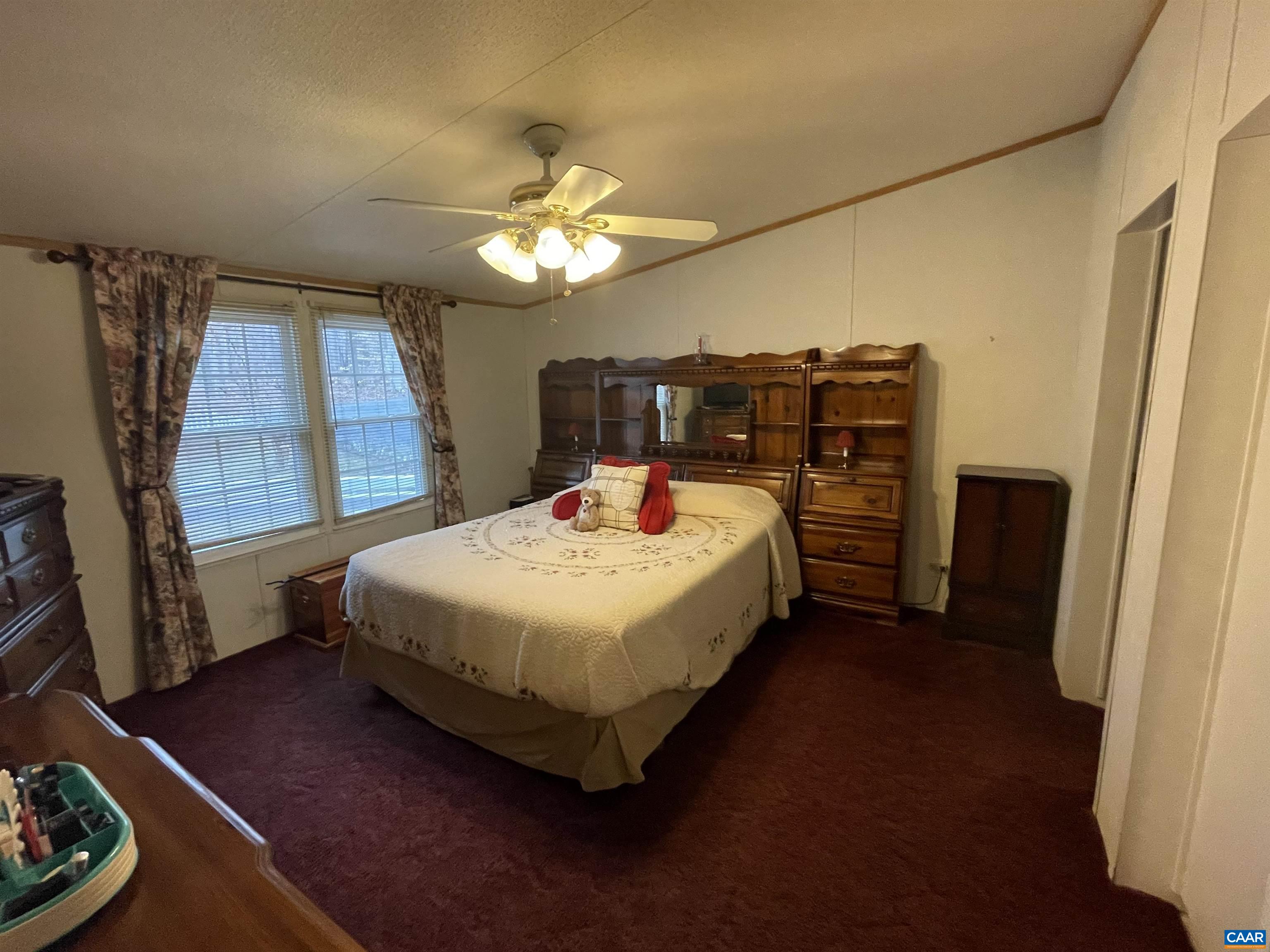 2925 Cloverdale Road Bremo Bluff, VA 23022 - Photo 12 of 23 a bedroom with a bed dresser and a window