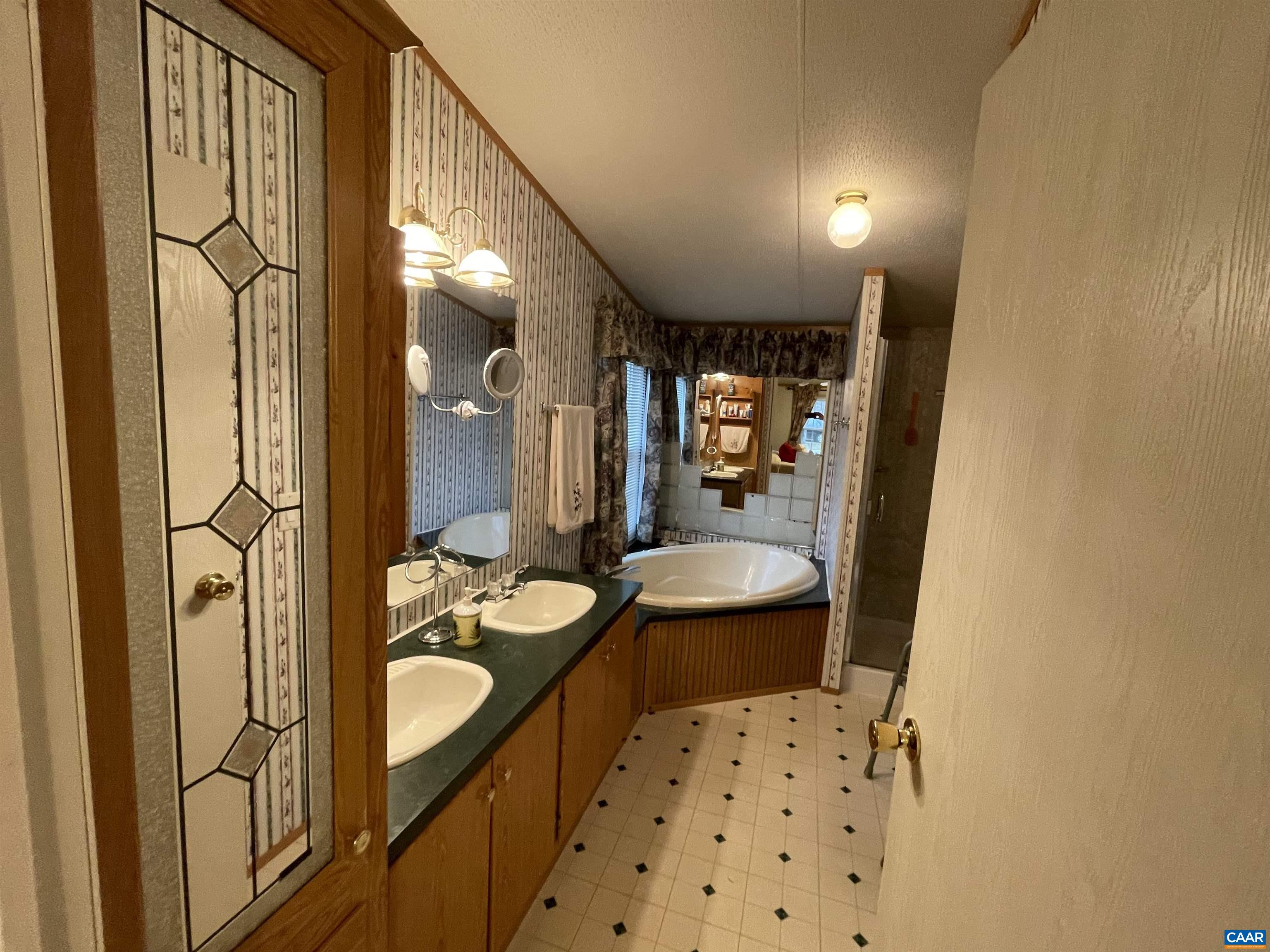 2925 Cloverdale Road Bremo Bluff, VA 23022 - Photo 14 of 23 a bathroom with a sink a toilet and shower