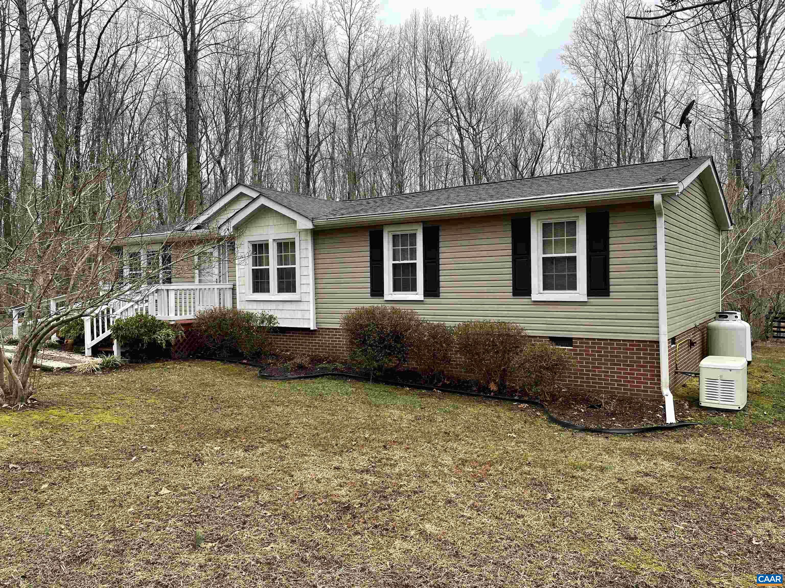 2925 Cloverdale Road Bremo Bluff, VA 23022 - Photo 5 of 23 a view of a house with a yard and large trees