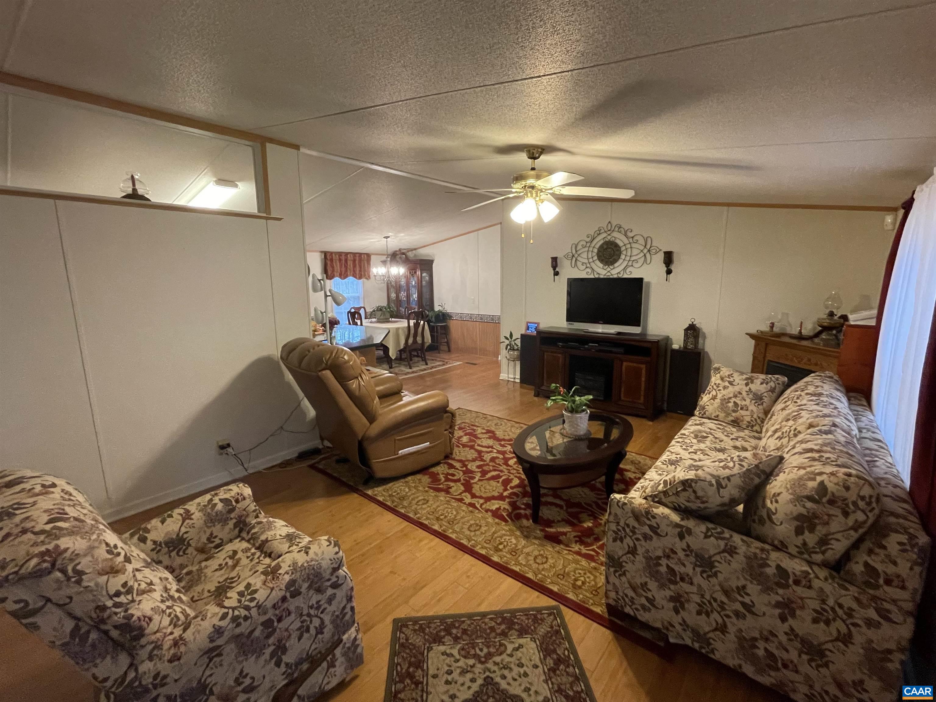 2925 Cloverdale Road Bremo Bluff, VA 23022 - Photo 6 of 23 a living room with furniture and a fireplace